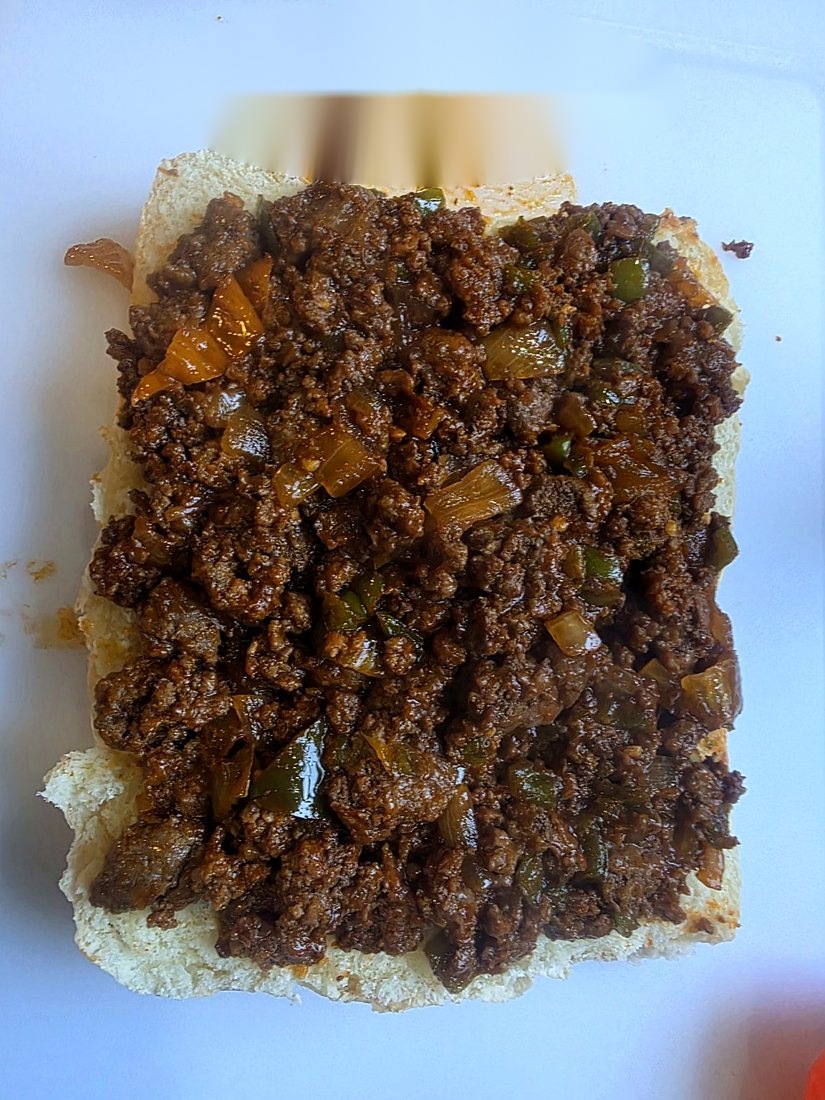 Sloppy joe filling piled onto a slider bun