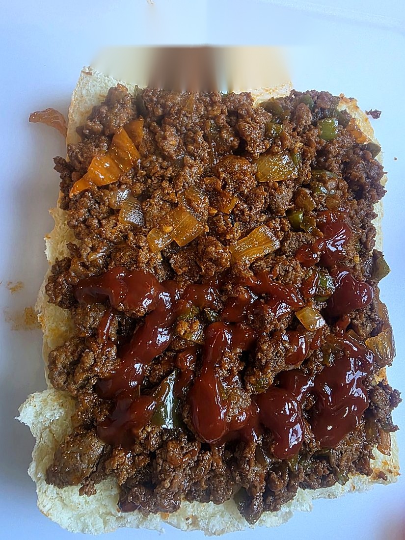 Sloppy slider filling topped with extra grill sauce